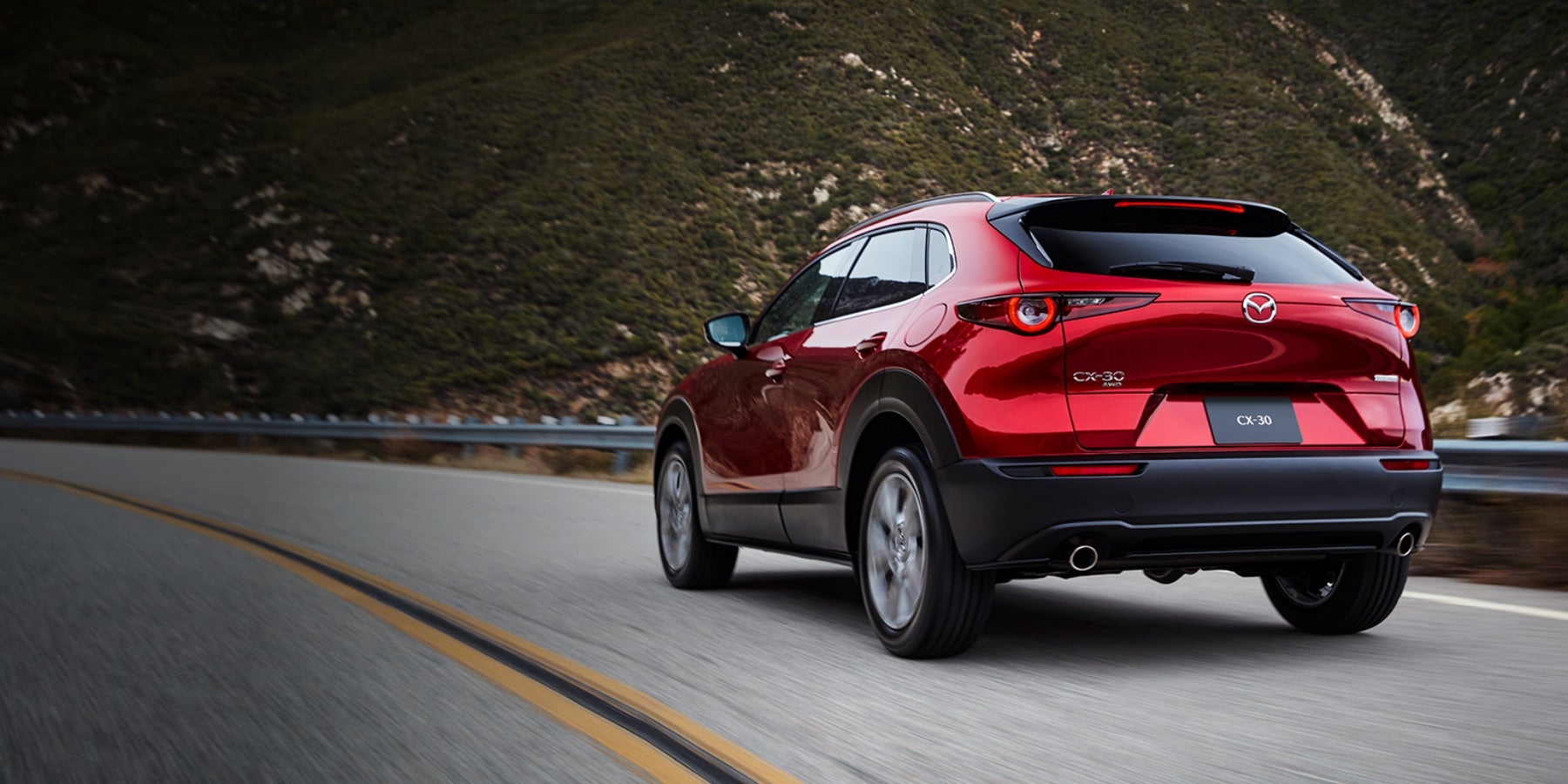 Red 2020 Mazda CX-30 Driving on the road | Knudtsen Foothills Mazda in Spokane, WA